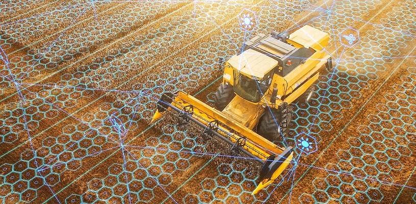 Smart farming: Connected Agricultural Harvester in operation guided and informed by Farm IoT system.